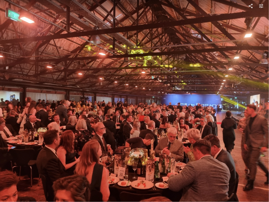 Large company event with crowd in a spacious venue