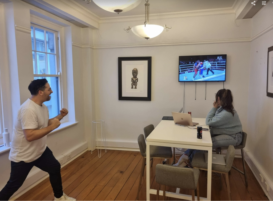 Team member presenting during a company meeting