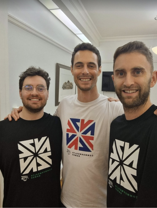 Three people posing for a photo at an event